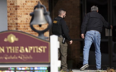 When the deputy came, the Nebraska priest, who was bleeding from many stabbings, shouted, "Help me."