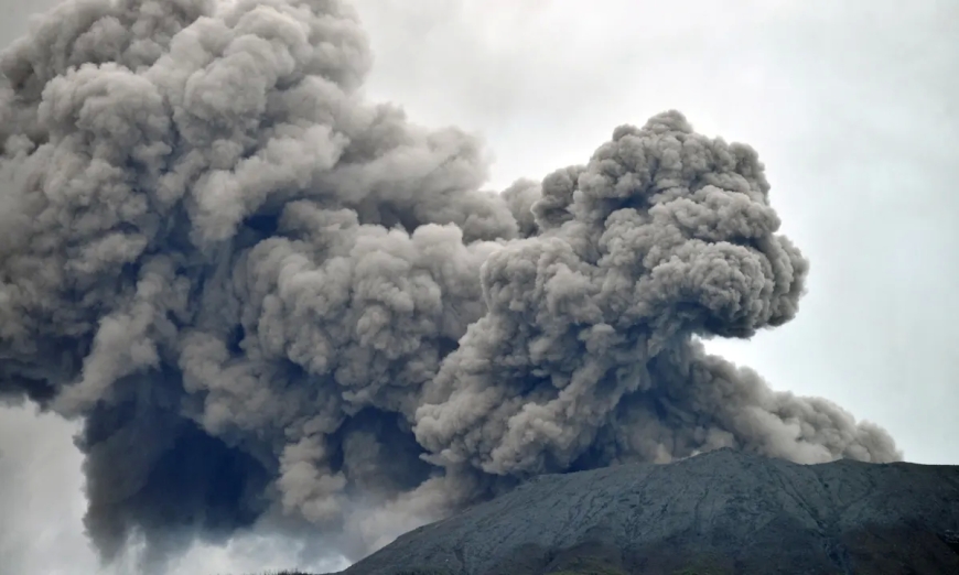 While the search is halted, an Indonesian volcano bursts, killing eleven hikers