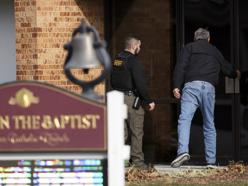 When the deputy came, the Nebraska priest, who was bleeding from many stabbings, shouted, "Help me."