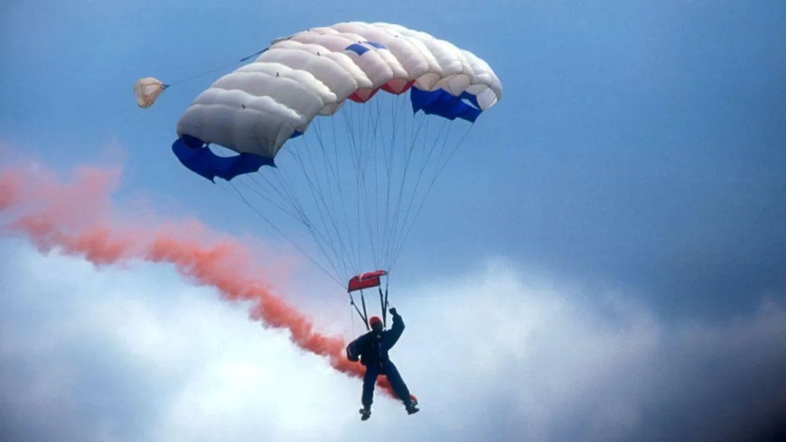 A Red Devils display team member died as a result of an unplanned parachute stunt