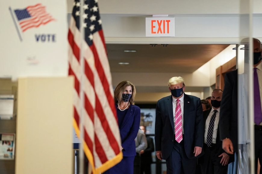 A voter protests Trump's inclusion on the Illinois ballot